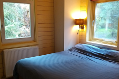 De slaapkamer van Boshuis De Toekan
