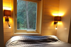 De slaapkamer van Natuurhuis De Toekan